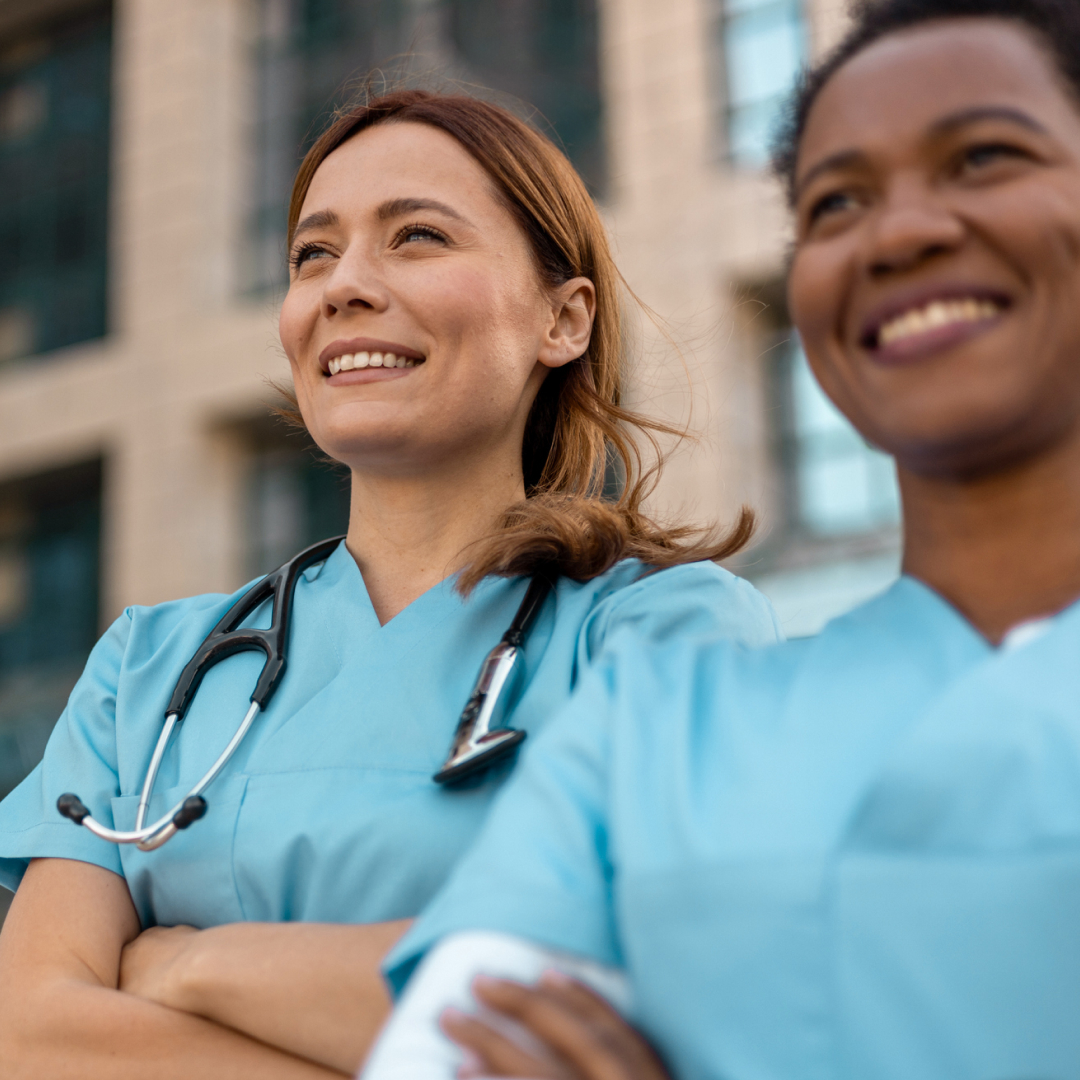 Two nurses smiling.