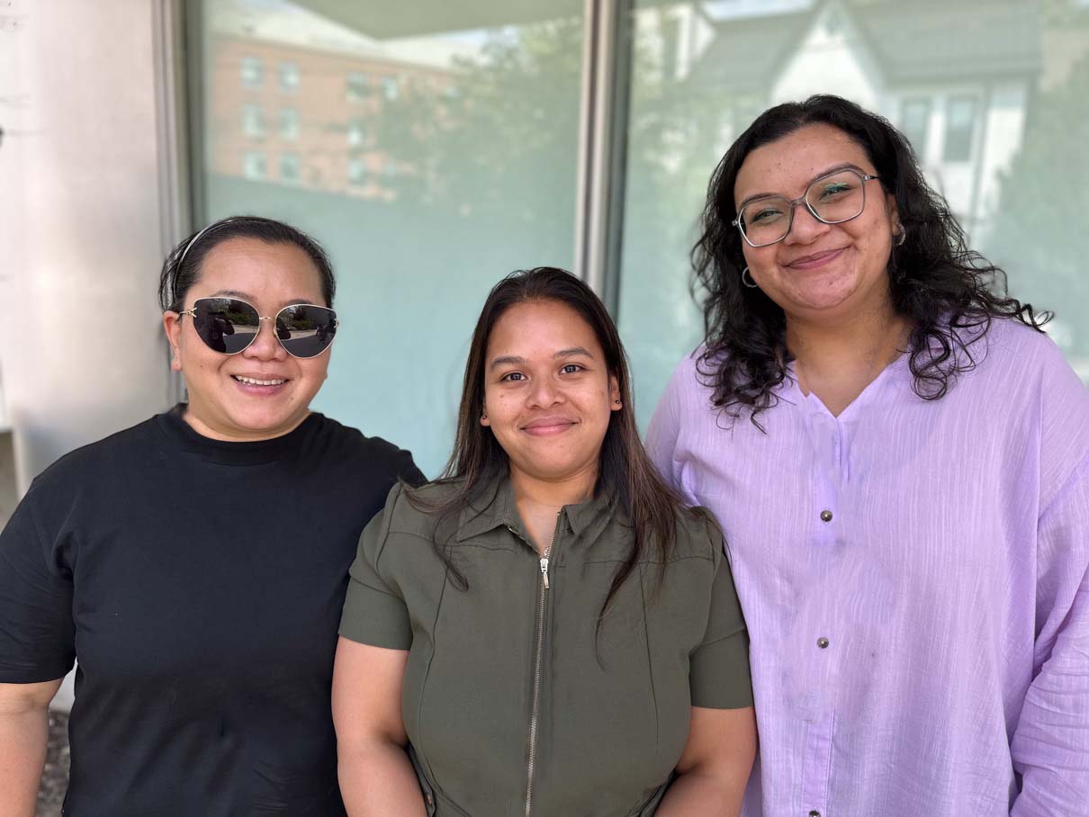 Three members of our team catching up at a summer event.